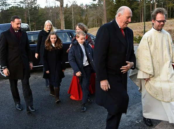 Crown Prince Haakon, Crown Princess Mette-Marit, Prince Sverre Magnus, Princess Ingrid Alexandra attend Christmas service. Crown Princess Mette-Marit wore Prada coat