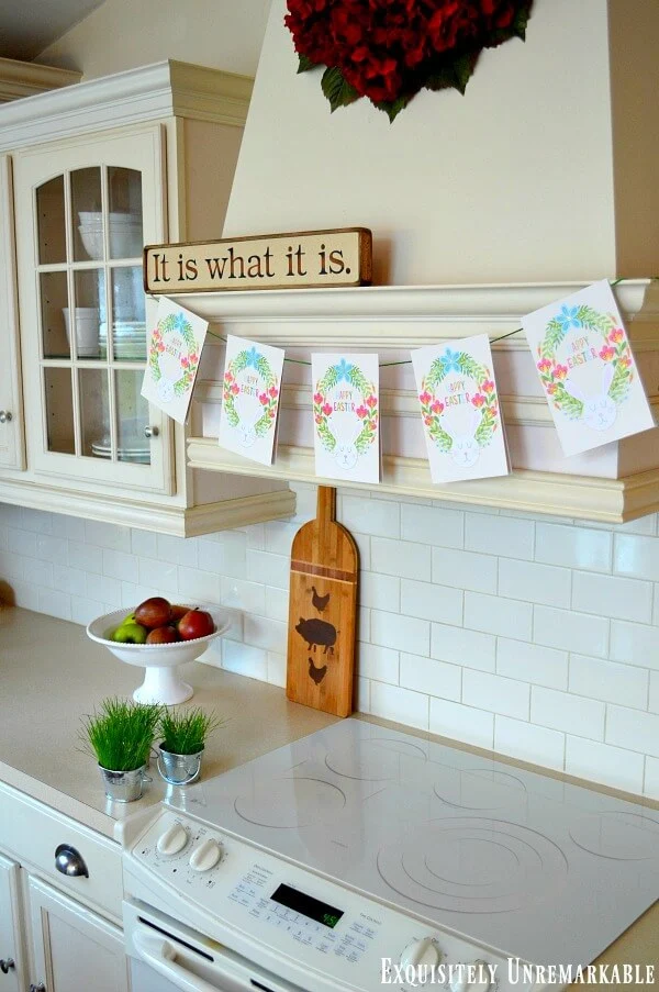 Easter Card Banner hanging on wooden kitchen hood over white stove