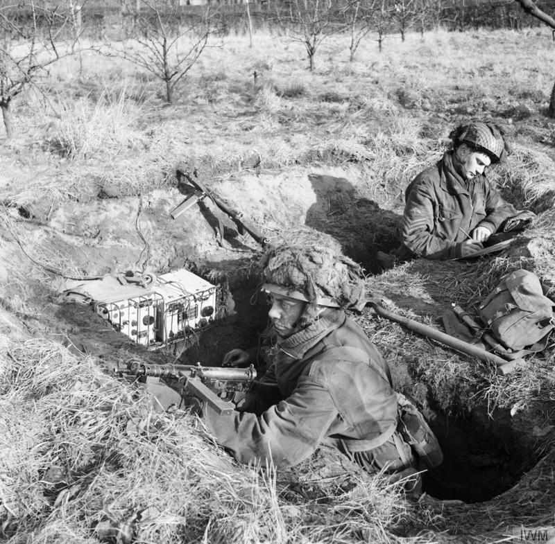 World War II History British paratroopers in a trench with a No.76