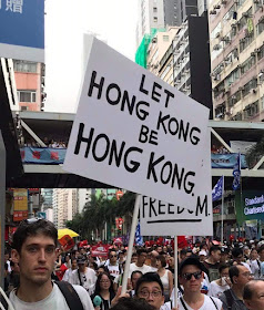 "let Hong Kong be Hong Kong" sign