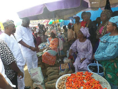 6 Photos: Ekiti state residents cheer Fayose as he walks on the street