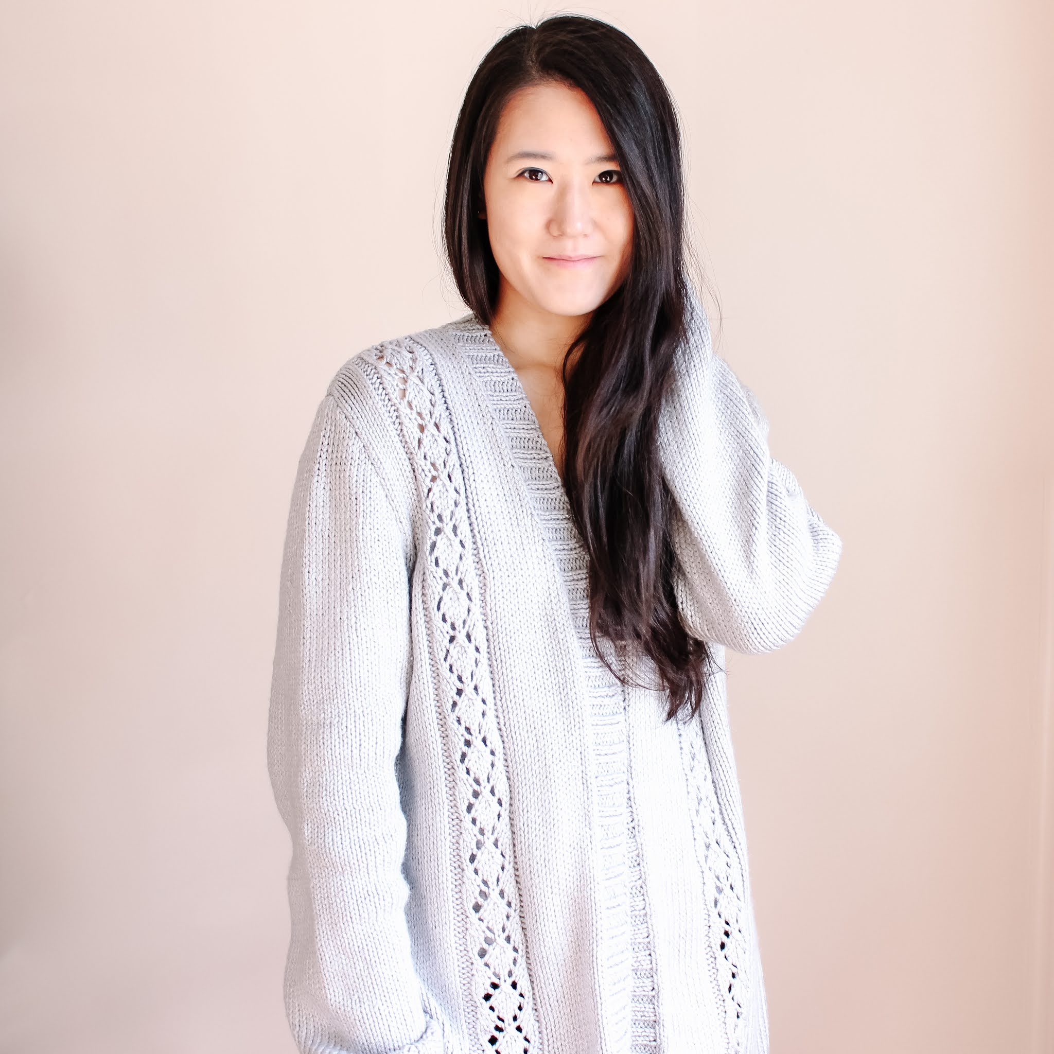 Designer of Modesty by Laura wearing the knit Silver Lining Cardigan.