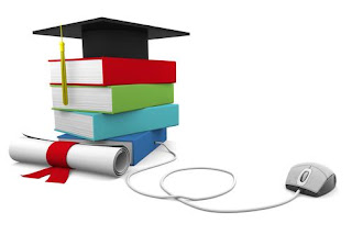 stacked books with graduation cap on top with computer mouse connected to the stack