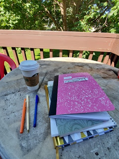 Picture of notebooks and coffee on a table