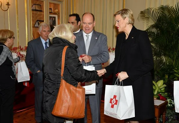 Prince Albert and Princess Charlene distributed gifts to beneficiaries of the Monaco Red Cross on the occasion of the national holiday