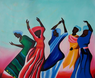 five African American women, in brightly colored dresses, dancing with their hands in the air