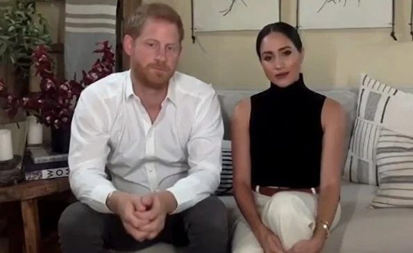 Meghan Markle wore a black renegade cashmere bodysuit by TUXE,  and a slash long sleeve top by Victor Glemaud,  ​linear bracelet by Monica Vinader