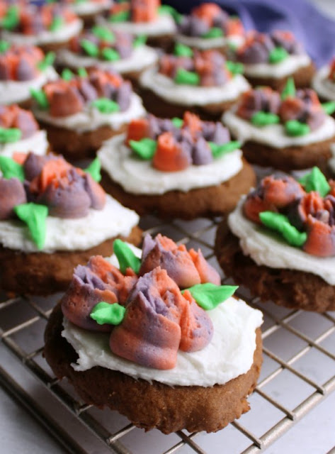 It is always fun to have a cookie cut in a pretty shaped and decorated with frosting, but you aren't limited to sugar cookies. There are lots of flavors and types of cookies you can roll and cut, here are a few of our favorite recipes. chocolate sour cream cookies decorated with buttercream flowers