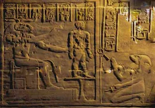 Heqet, knelling, is the Egyptian goddess of childbirth