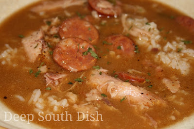 Miss Lucy's Cajun Style Chicken Gumbo - a delicious and easy gumbo made with a roux, the Trinity of vegetables and using a whole chicken and andouille sausage.