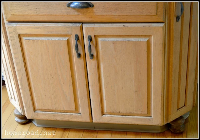 Bun feet added to kitchen cabinets before painting.