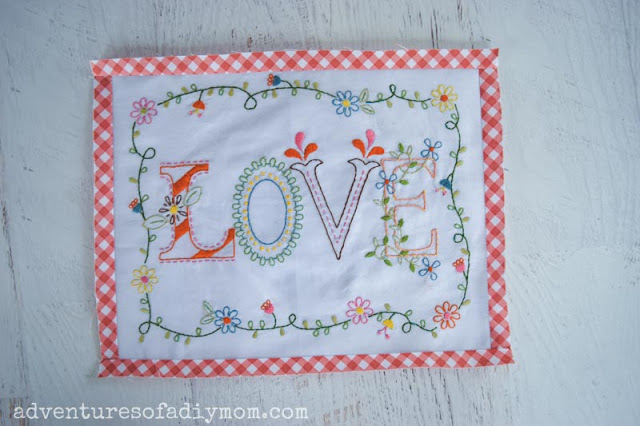 embroidered fabric with a checkered border