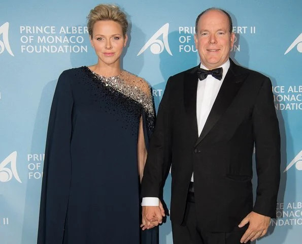 Princess Charlene wore Oscar De La Renta Navy Embroidered Illusion And Stretch-Georgette Cape-Back Caftan