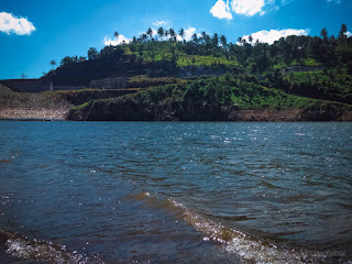Calm Lake Water Wave Of Titab Ularan Dam And The Hills Scenery On A Sunny Day In The Dry Season North Bali Indonesia