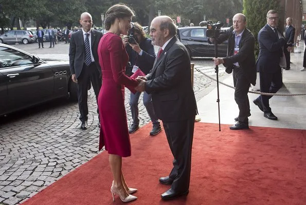 Queen Letizia wore Carolina Herrera red dress, carried Felipe Varela clutch bag. Queen visited the Spanish Royal Academy in Rome