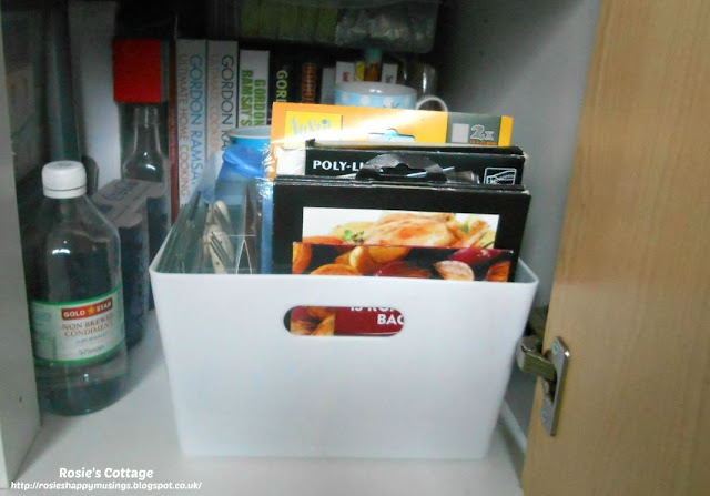 Kitchen Cabinet Re-Organisation: As with the upper shelf, I've used a container to store items such as roasting bags and toasting pockets. 