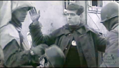 American soldiers roughly handle German POW