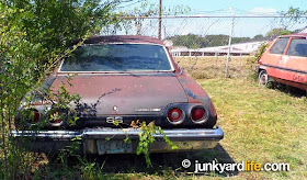 Cars in yards: A 1973 Chevy Chevelle SS found next to a 1981 Renault LeCar.
