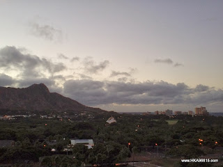 This photo shows the view of the sun rising behind Diamond Head