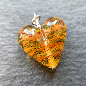 Handmade lampwork glass heart bead by Laura Sparling made with CiM Circus Tent