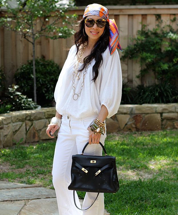 hermes scarf on head and kelly with summer white outfit and lots of bracelets