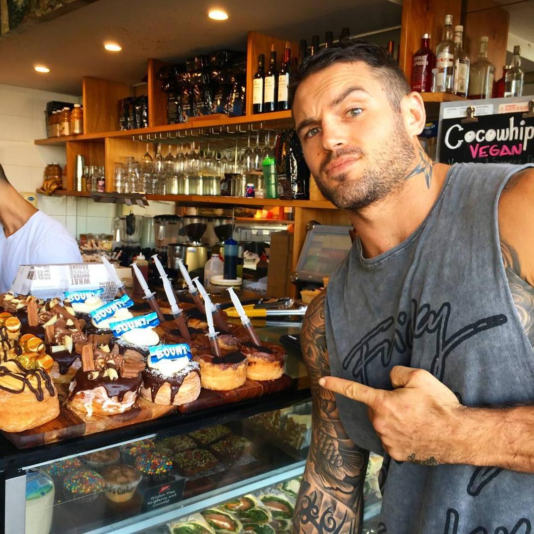 sexy-straight-masculine-tattoo-man-sweets-shop-bounty-coconut-chocolates-heaven