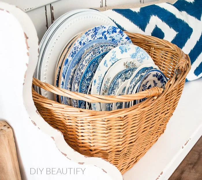 basket filled with vintage dishes
