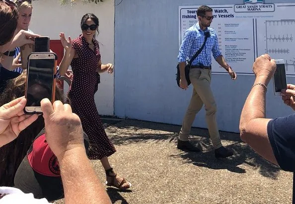 Meghan Markle wore &Other Stories Waist Knot Midi Dress and Sarah Flint Grear Lace Up Sandals. Prince Harry' Australia tour