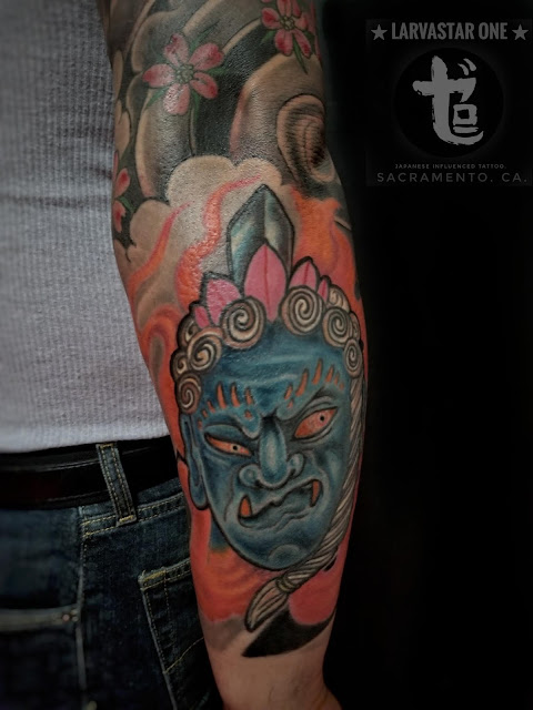 blue Fudo Myo-o surrounded by flames placed on a inner forearm done at zero one ink tattoo studio sacramento California