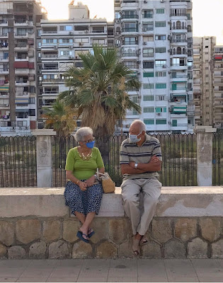 A cute couple wearing masks in Port Said