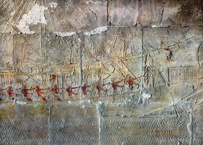 One of Hatshepsut's Punt ships setting sail, with red-painted Egyptians at the oars and Red Sea creatures swimming in the waters beneath