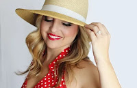 Smiling woman wearing hat and lipstick