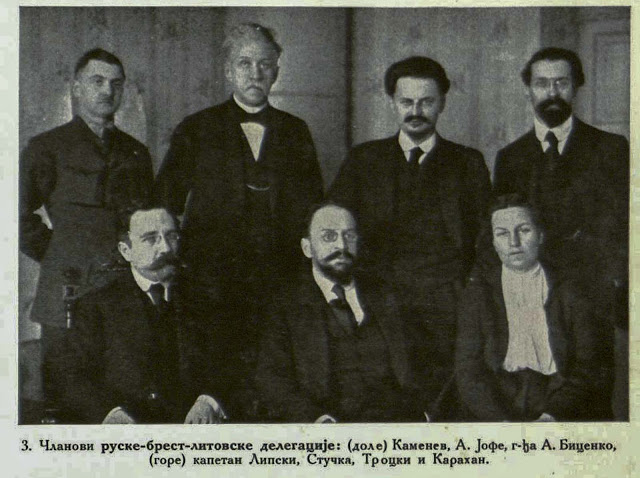 Members of tin Russian Brest-Litovsk Delegation (sitting below) L. Kamenev, A. Joffe, Madame A. Bicenko (standing from the left) Captain Lipski, Stucka, Trotzki, Karahan