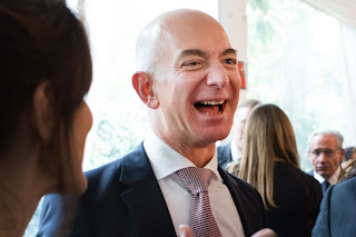 Laughing Jeff Bezos