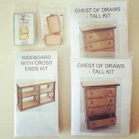 Selection of one-twelfth scale modern miniature kits including trays, chests of drawers and a bookcase with cross ends