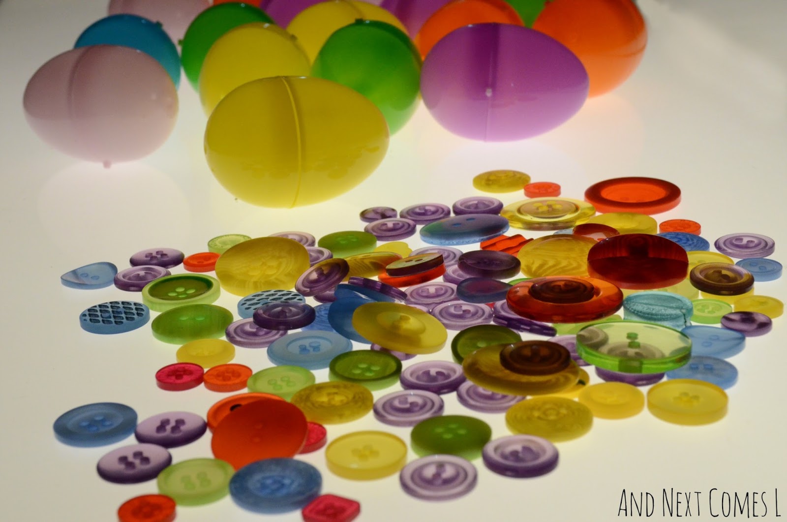 Plastic eggs and buttons on the light table