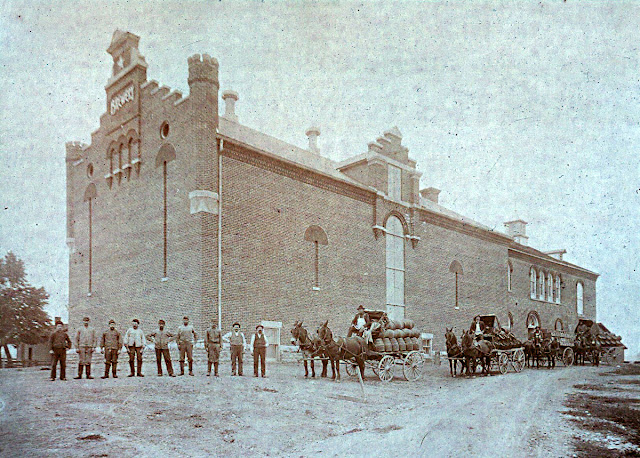Undated photo of workers and wagons in front of the Star Brewery in Minster, Ohio.