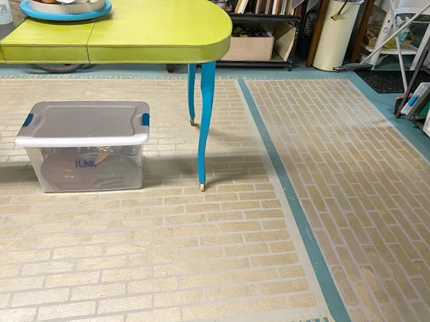 Stenciled floor using brick stencil and metallic gold paint