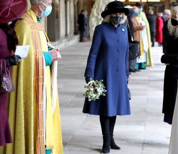The Duchess of Cornwall wore a blue wool coat, and wears a face mask