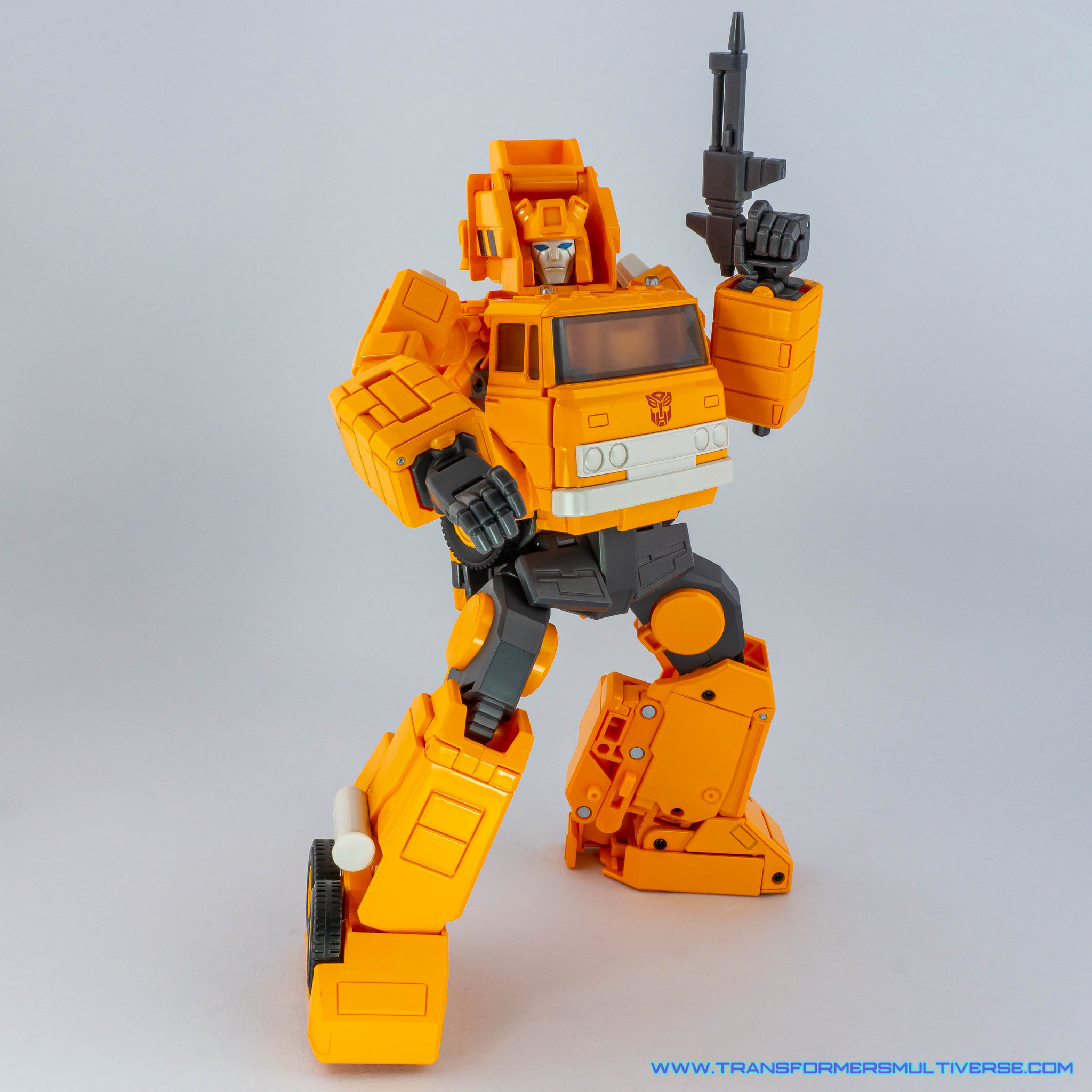 Transformers Masterpiece Grapple with cartoon head and chest posed 3