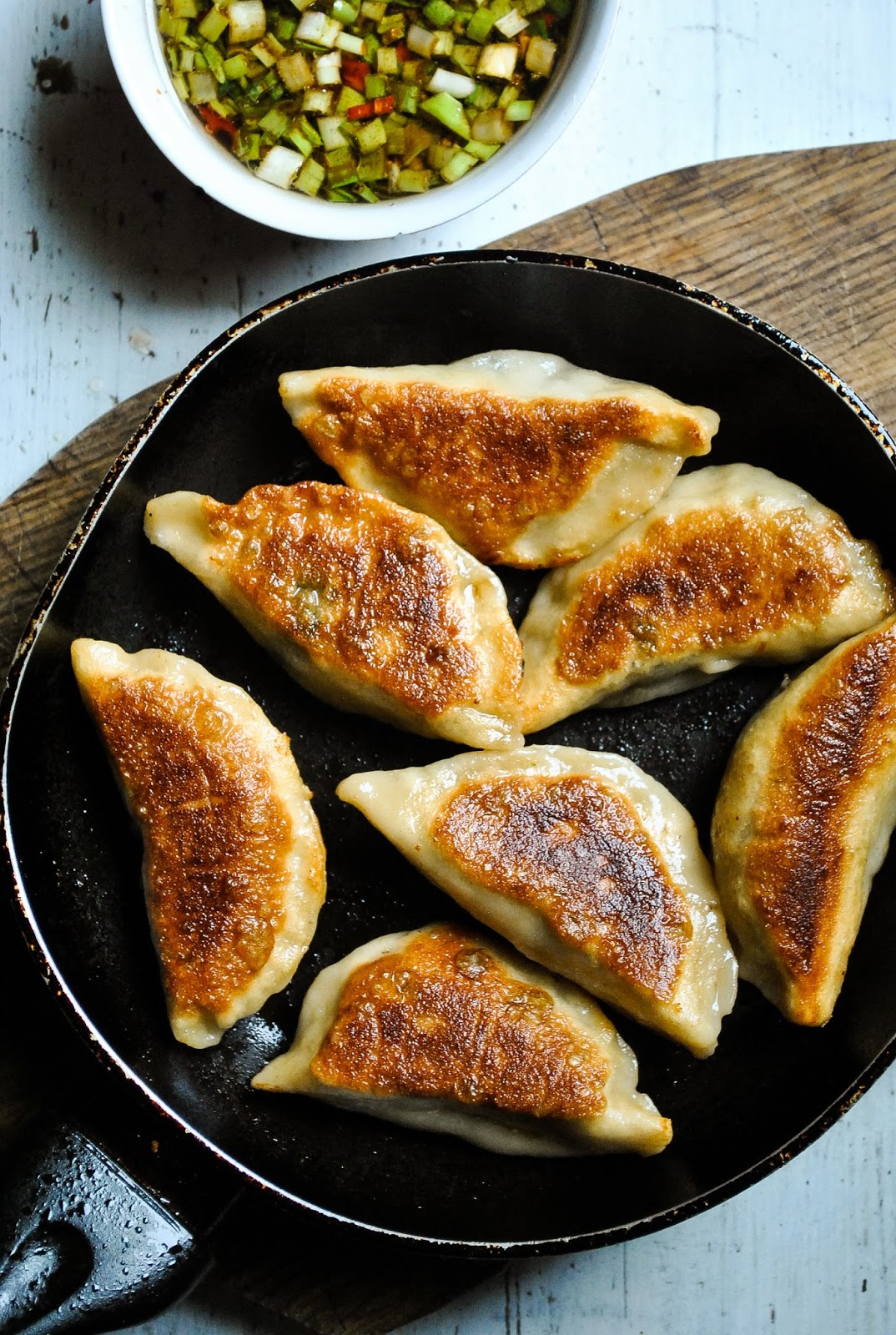 Crispy pot stickers (Chinese dumplings) with spicy mushroom and spinach ...