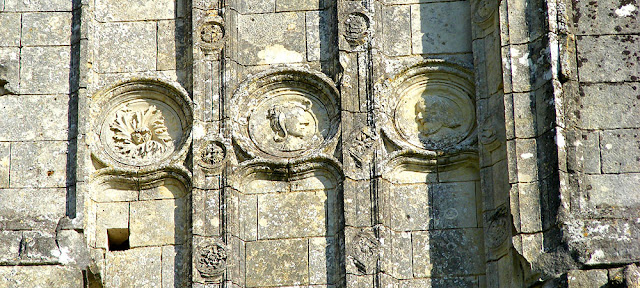 Decorative medallions on the western front of the ruined church of Les Roches Tranchelion. Photo by Loire Valley Time Travel. Decorative medallions on the western front of the ruined church of Les Roches Tranchelion. Photo by Loire Valley Time Travel.