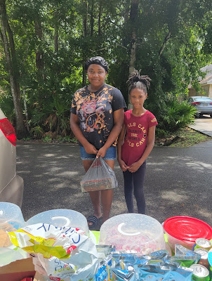 Aniyah Bell and her friend at the West Augustine block party