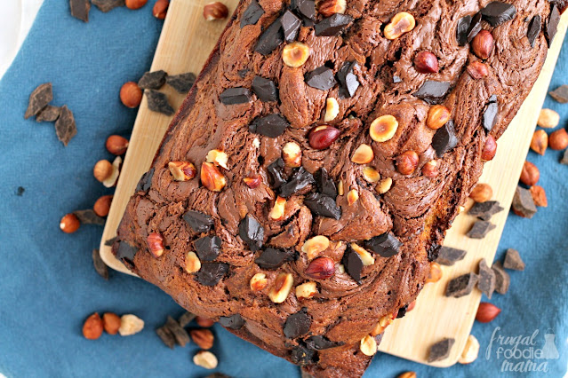 This homemade Chocolate Hazelnut Banana Bread is chock full of toasted hazelnuts and dark chocolate chunks. But the best part of this banana bread just might be the swirl of chocolate hazelnut spread baked right into each slice.