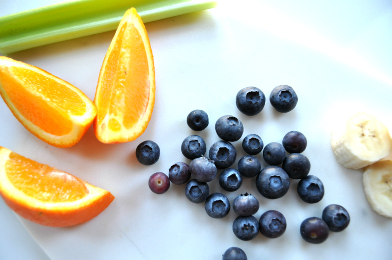 Fresh oranges, blueberries, celery and banana for juicing