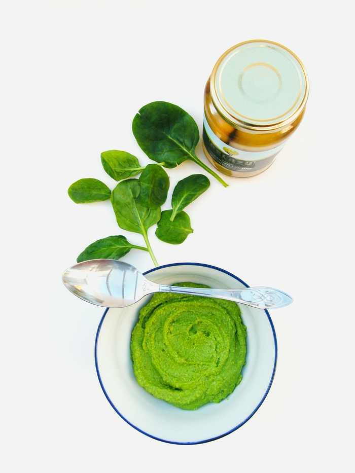 A rich green pesto made with lemon and spinach. This recipe be whizzed up quickly in a blender and served on pasta, in wraps or on bruschetta. Suitable for vegans.