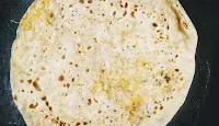 Roasting paneer paratha on pan or tawa for paneer paratha recipe