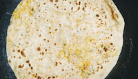 Roasting paneer paratha on pan or tawa for paneer paratha recipe