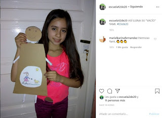 se ve la foto de una publicación en Instagram donde una alumna sin delantal sostiene a una figura humana construida con cartón y papeles