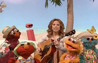 Sheryl Crow, Elmo, Zoe, Telly and Rosita sing I Soaks Up the Sun. Sesame Street All Star Alphabet